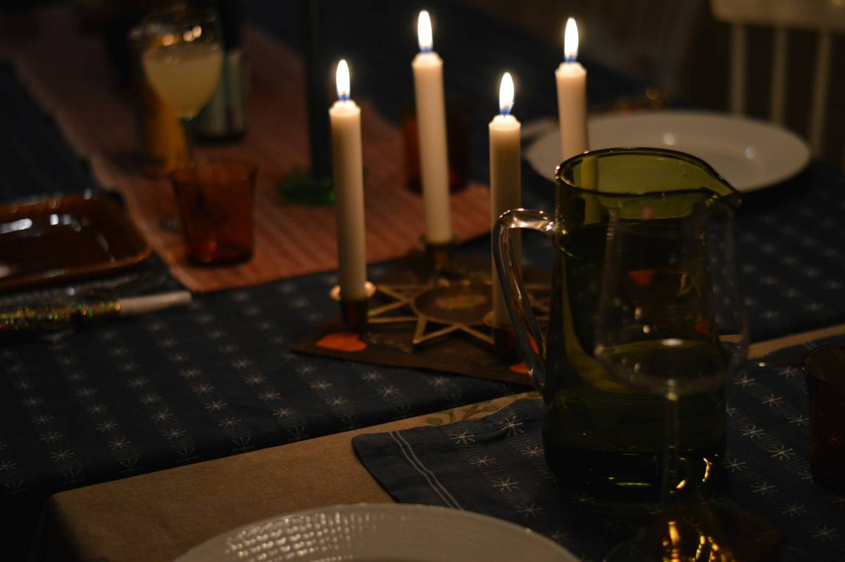 Elegant candle rings for dinner candles on a rustic dining table setup